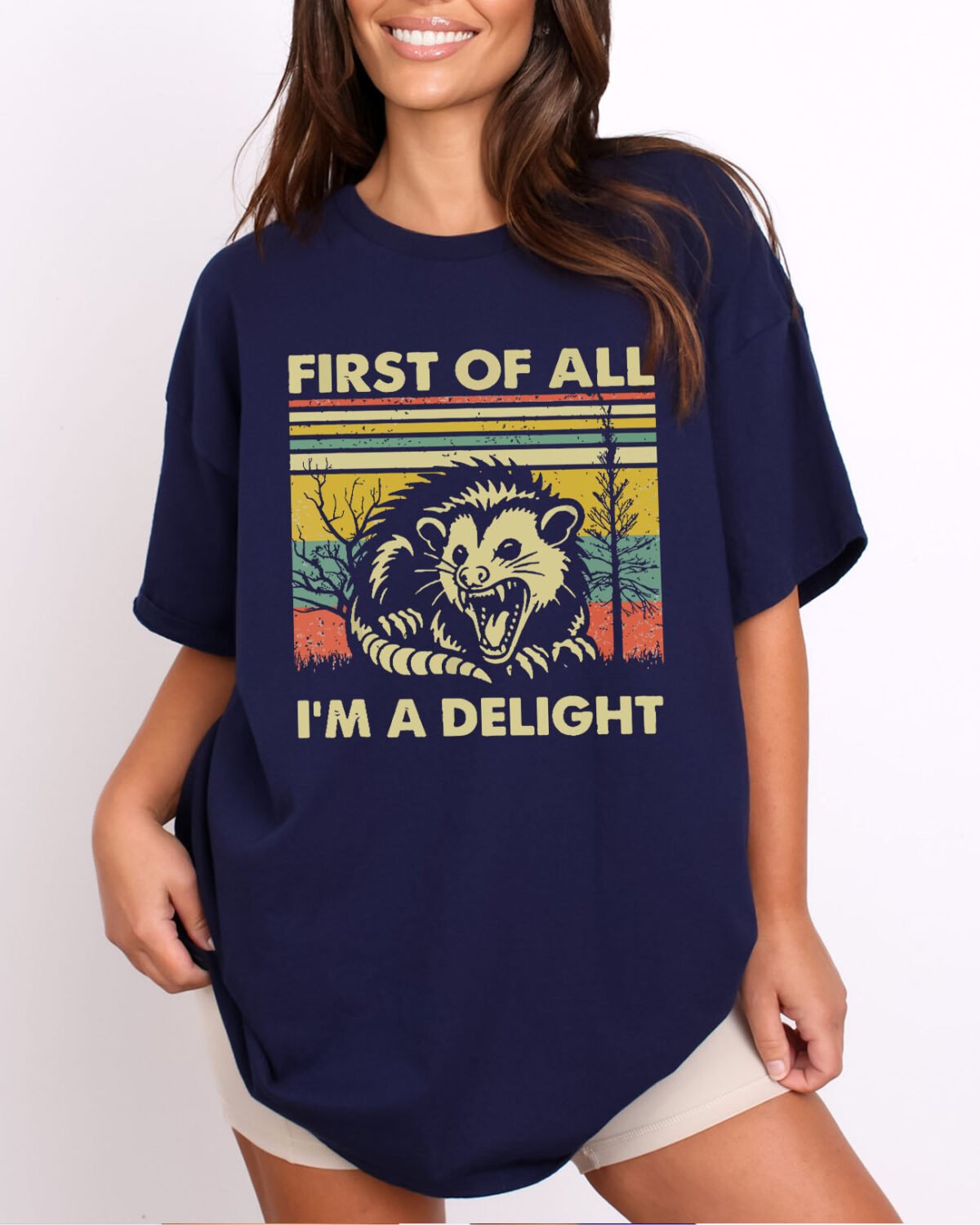 Woman wearing a First Of All I'm A Delight Shirt in navy blue color, featuring a funny retro opossum graphic