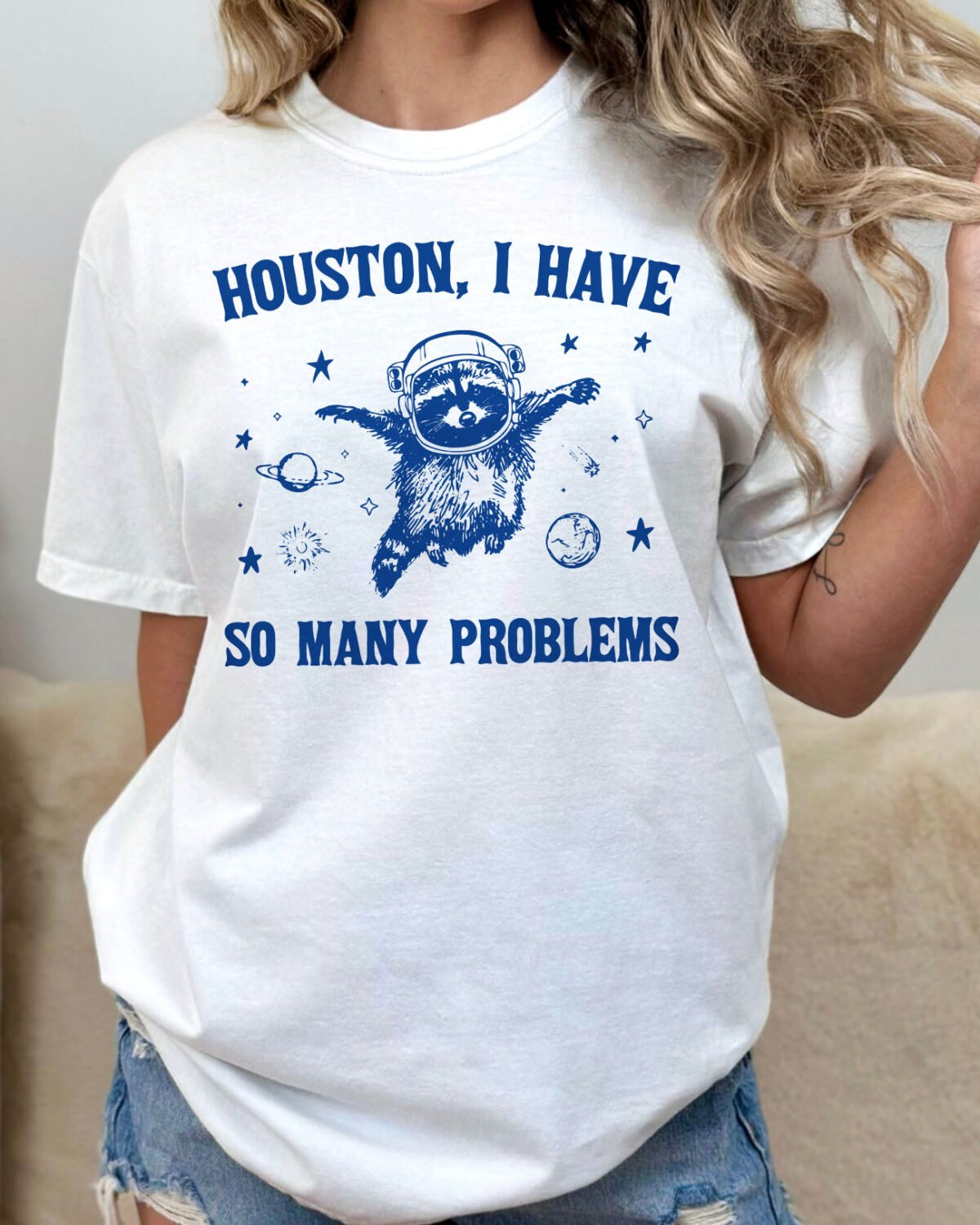 Woman wearing a houston I have so many problems shirt in white color