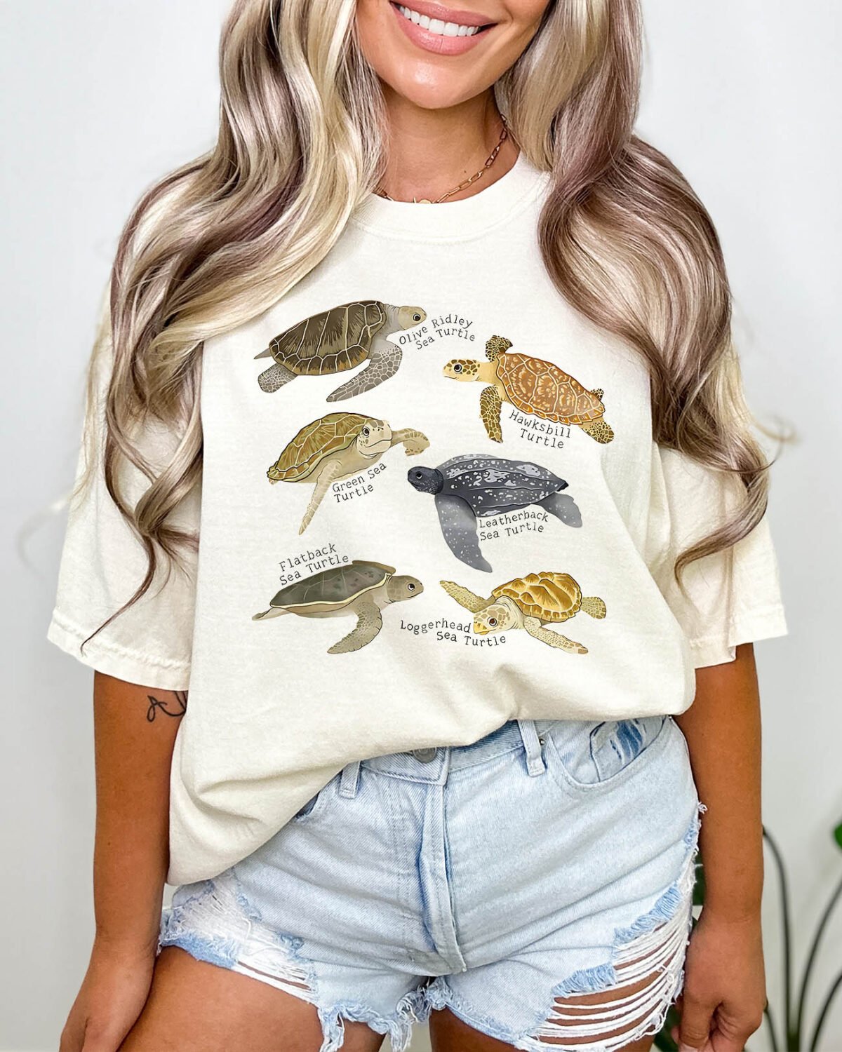 Woman wearing a retro turtles shirt in natural beige color