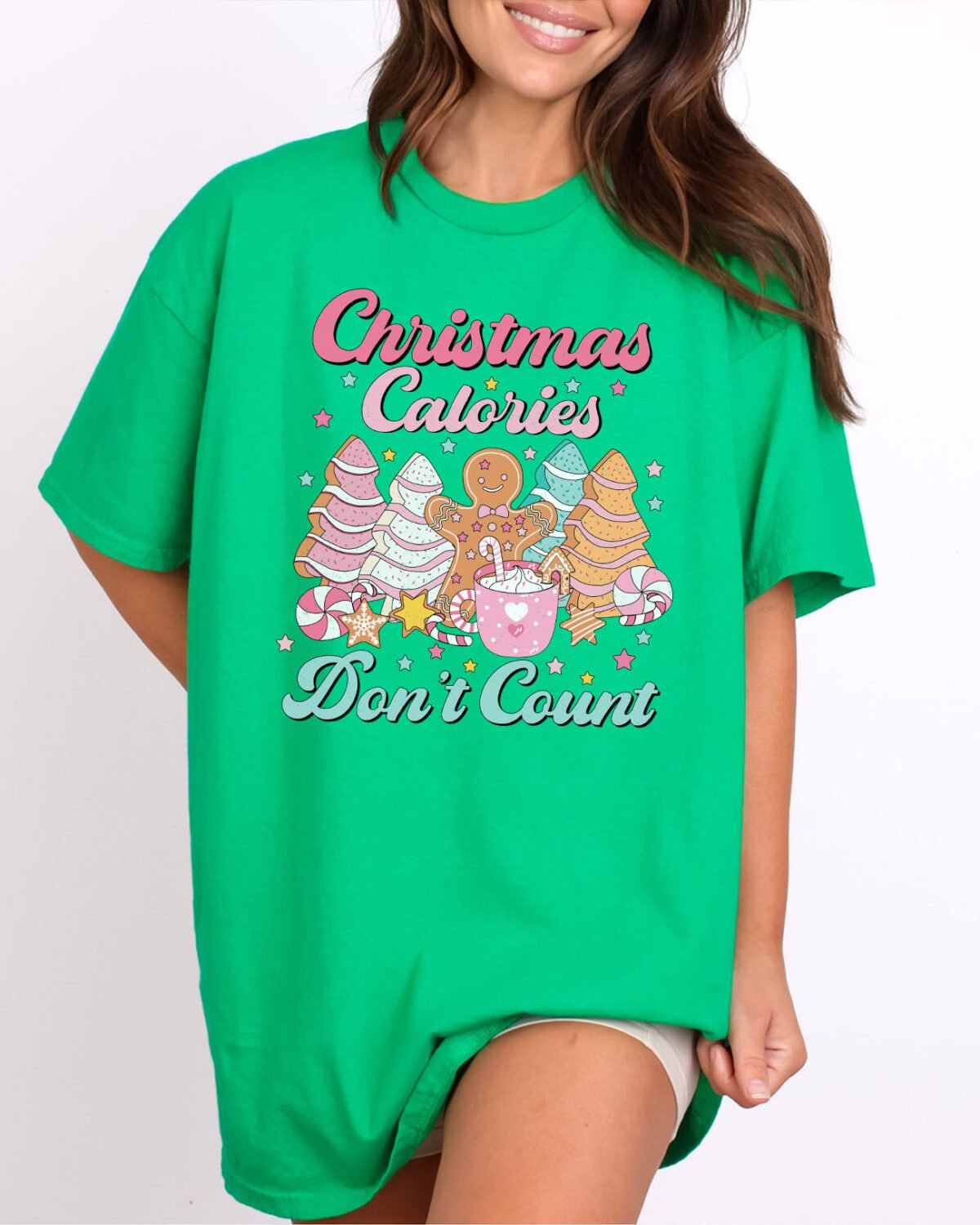 Woman wearing a Christmas Calories Don't Count Shirt in irish green color