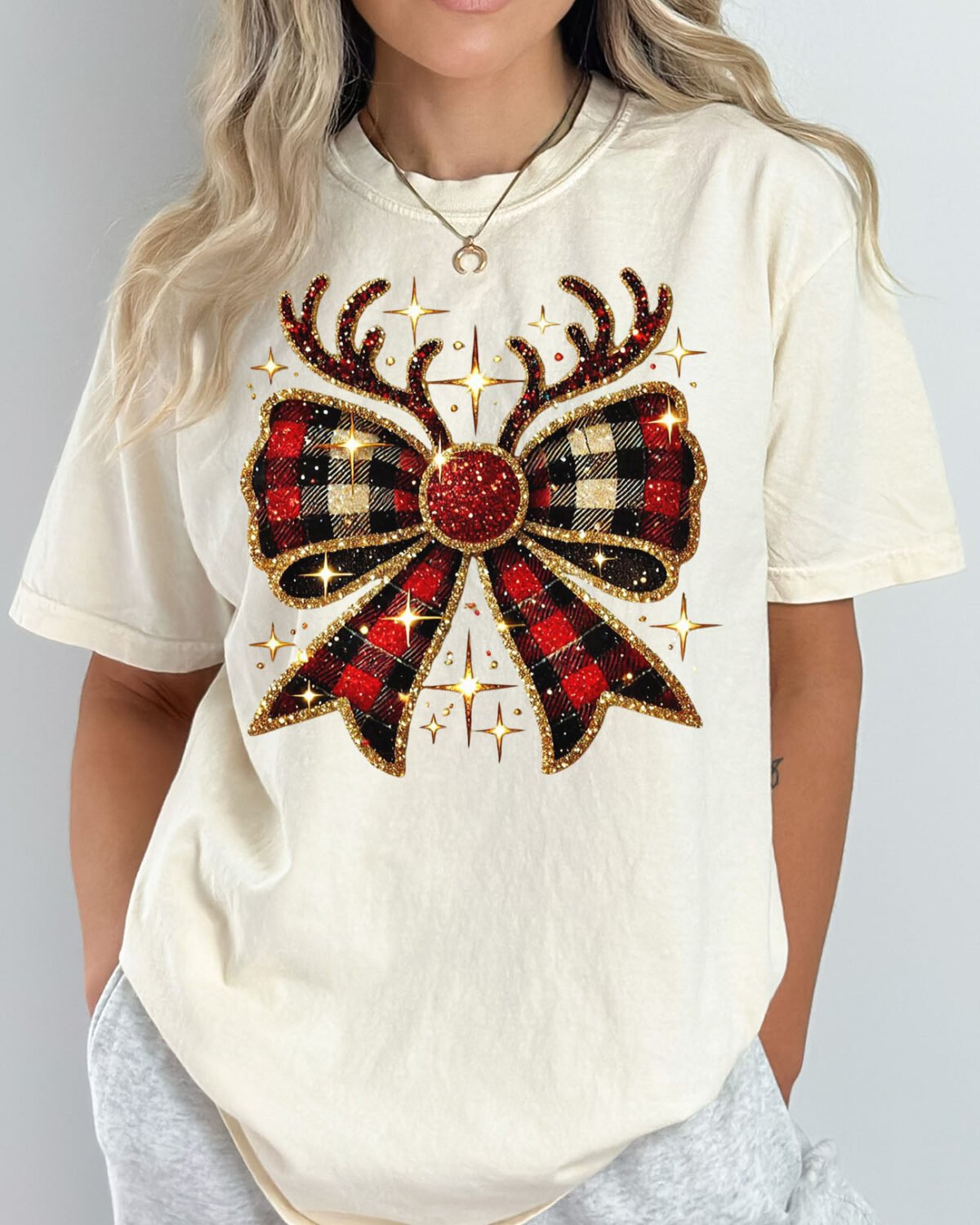 Woman wearing a Christmas reindeer bow shirt in natural color