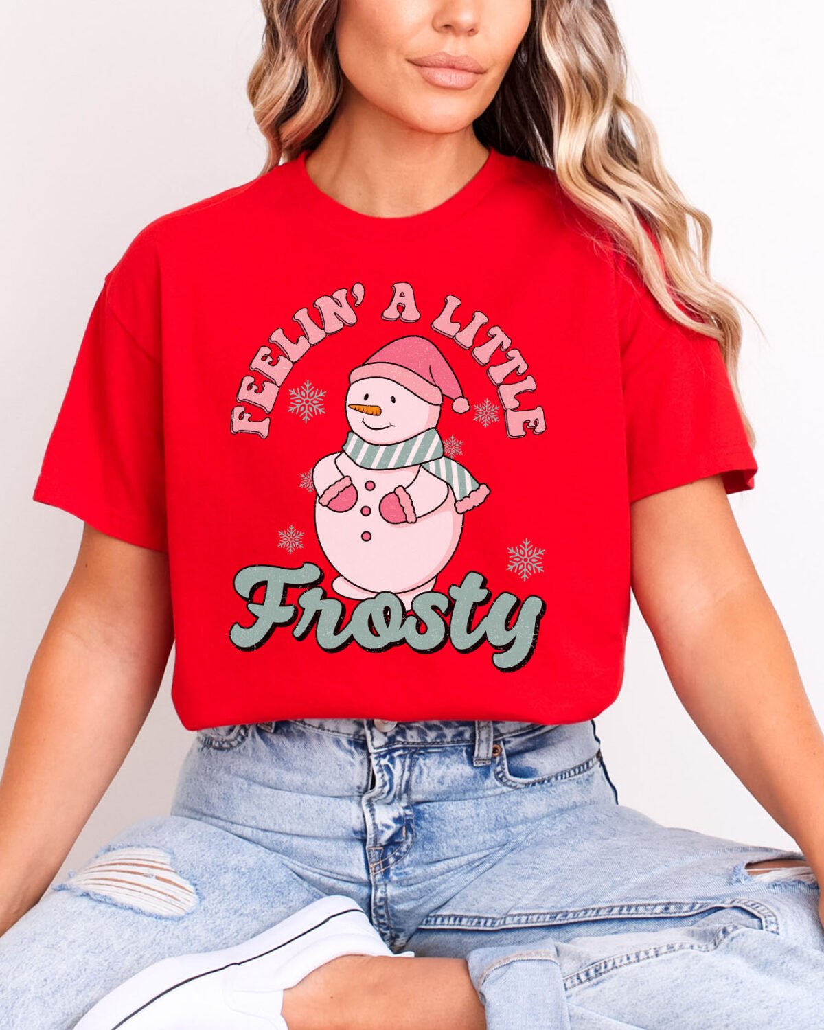 Woman wearing a Feelin' A Little Frosty Shirt in red color