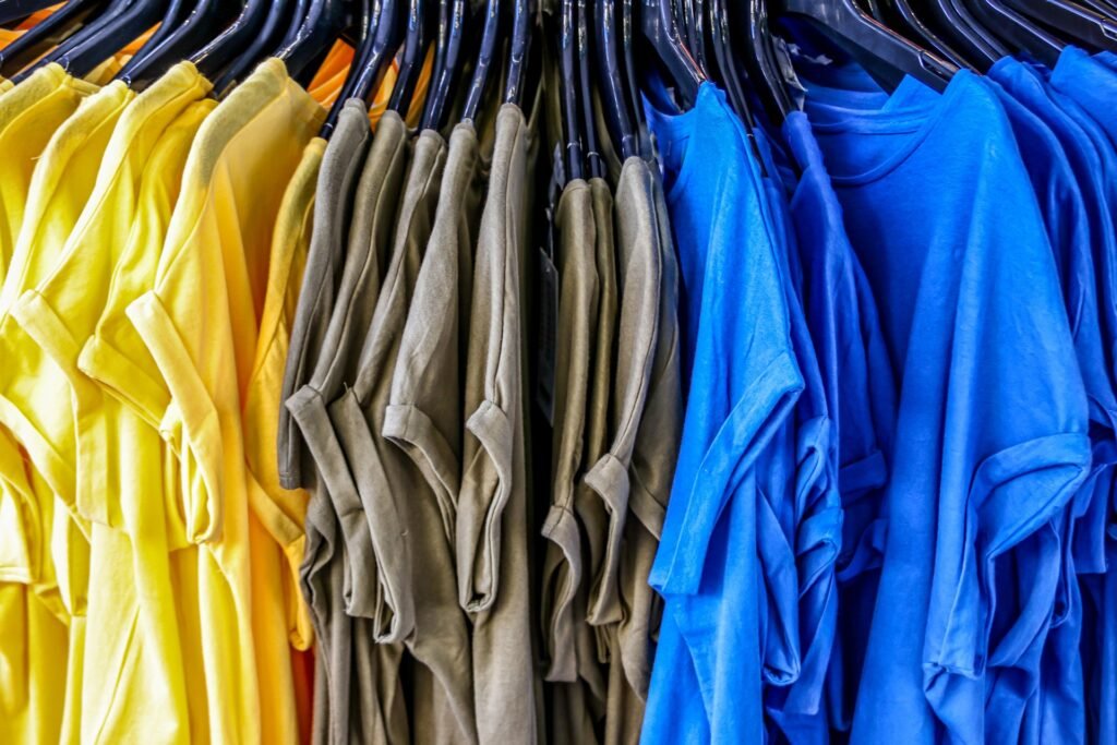 Shirts hanging on a coat hanger. Example image for the blog article on how to shrink a shirt